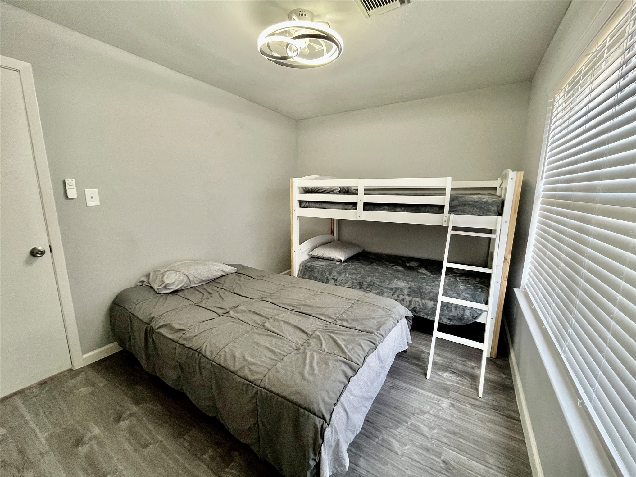 610 Seashell Drive Surfside Beach, TX 77541 - Photo 31 of 42 a bedroom with a bed and a window