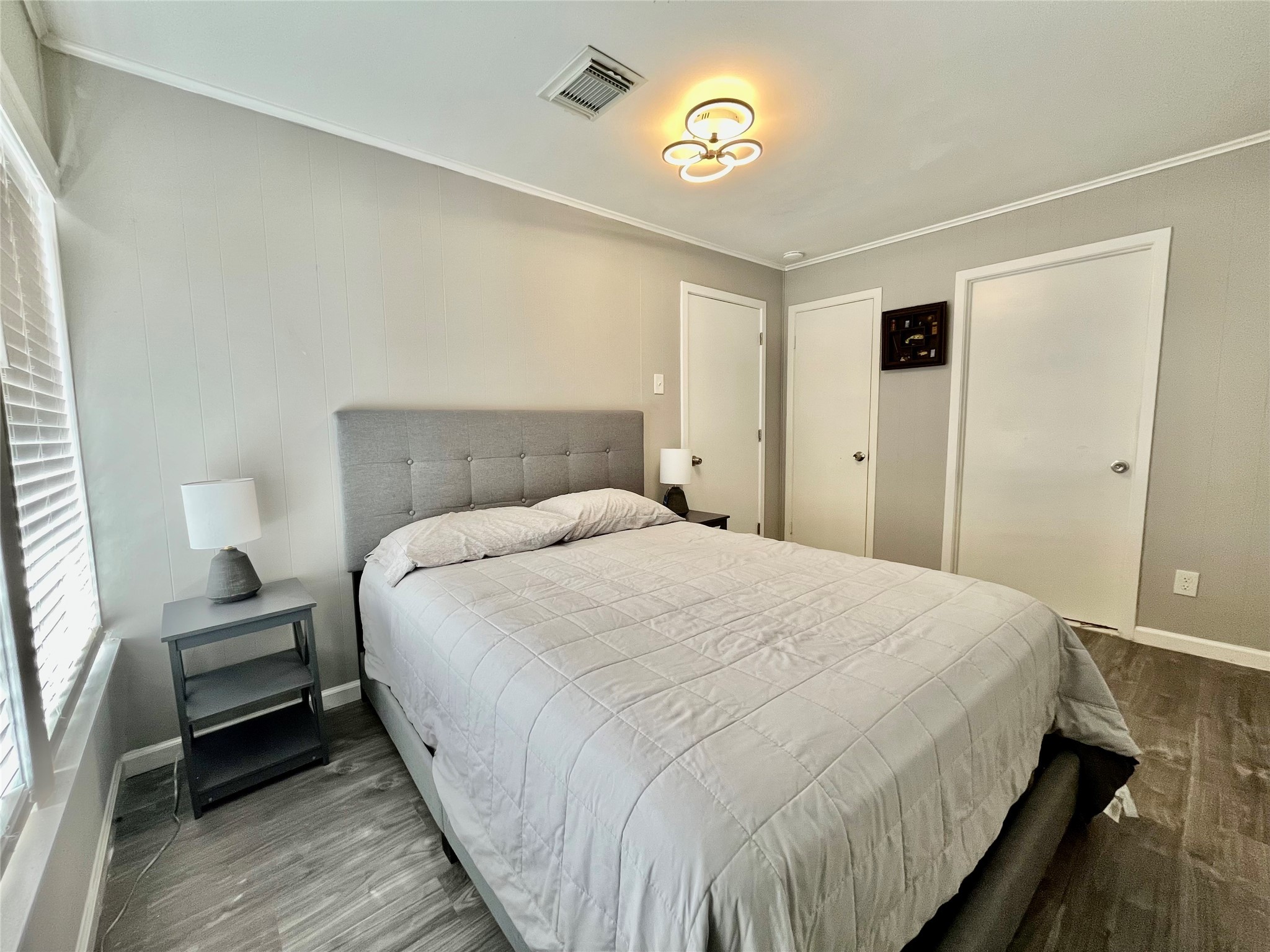 610 Seashell Drive Surfside Beach, TX 77541 - Photo 38 of 42 a bedroom with bed and a night stand