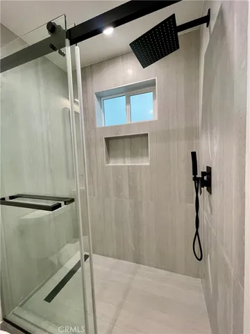 a bathroom with a shower and a tub