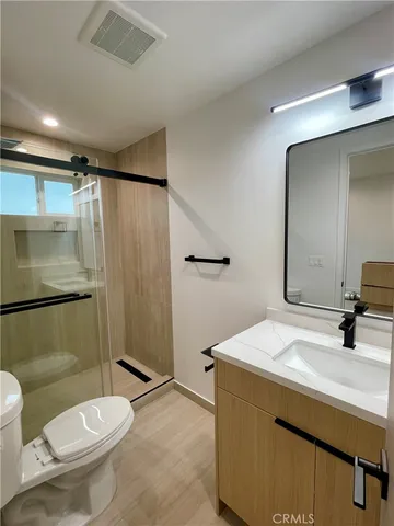 a bathroom with a shower and a sink