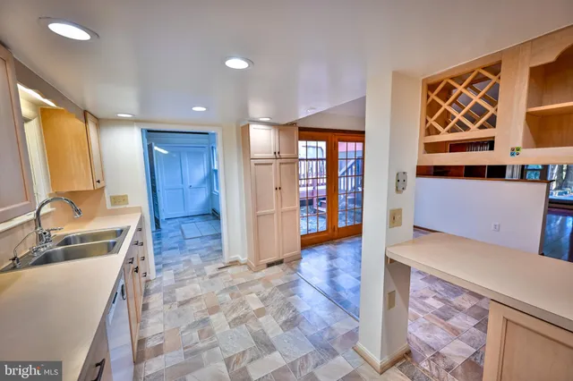 a view of a livingroom with wooden floor and windows