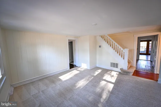 a bathroom with a granite countertop sink toilet a mirror and shower