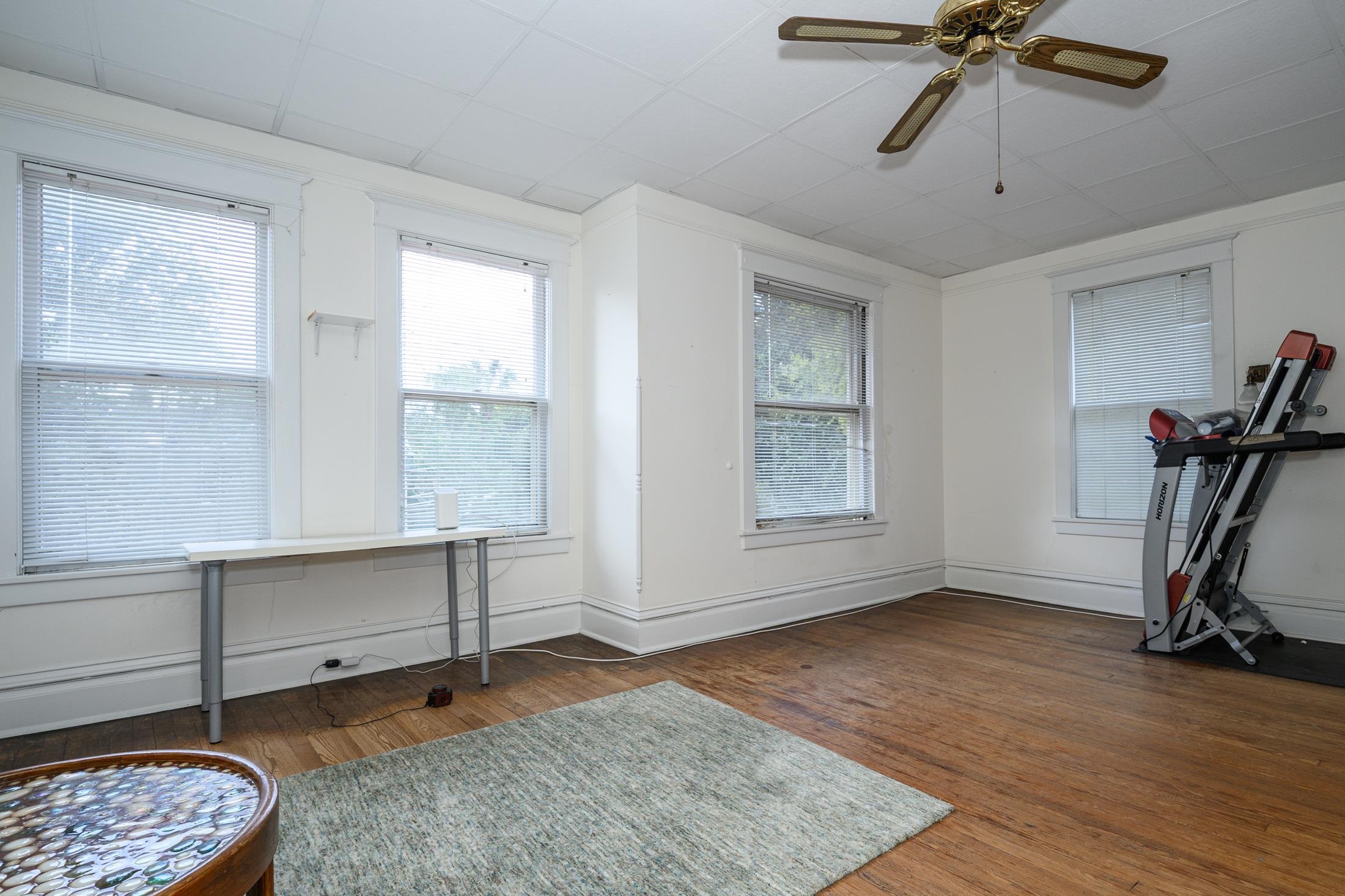 24 Saragossa Street St. Augustine, FL 32084 - Photo 64 of 99 a view of room with a window and wooden floor