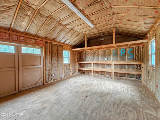 a view of a room with wooden walls