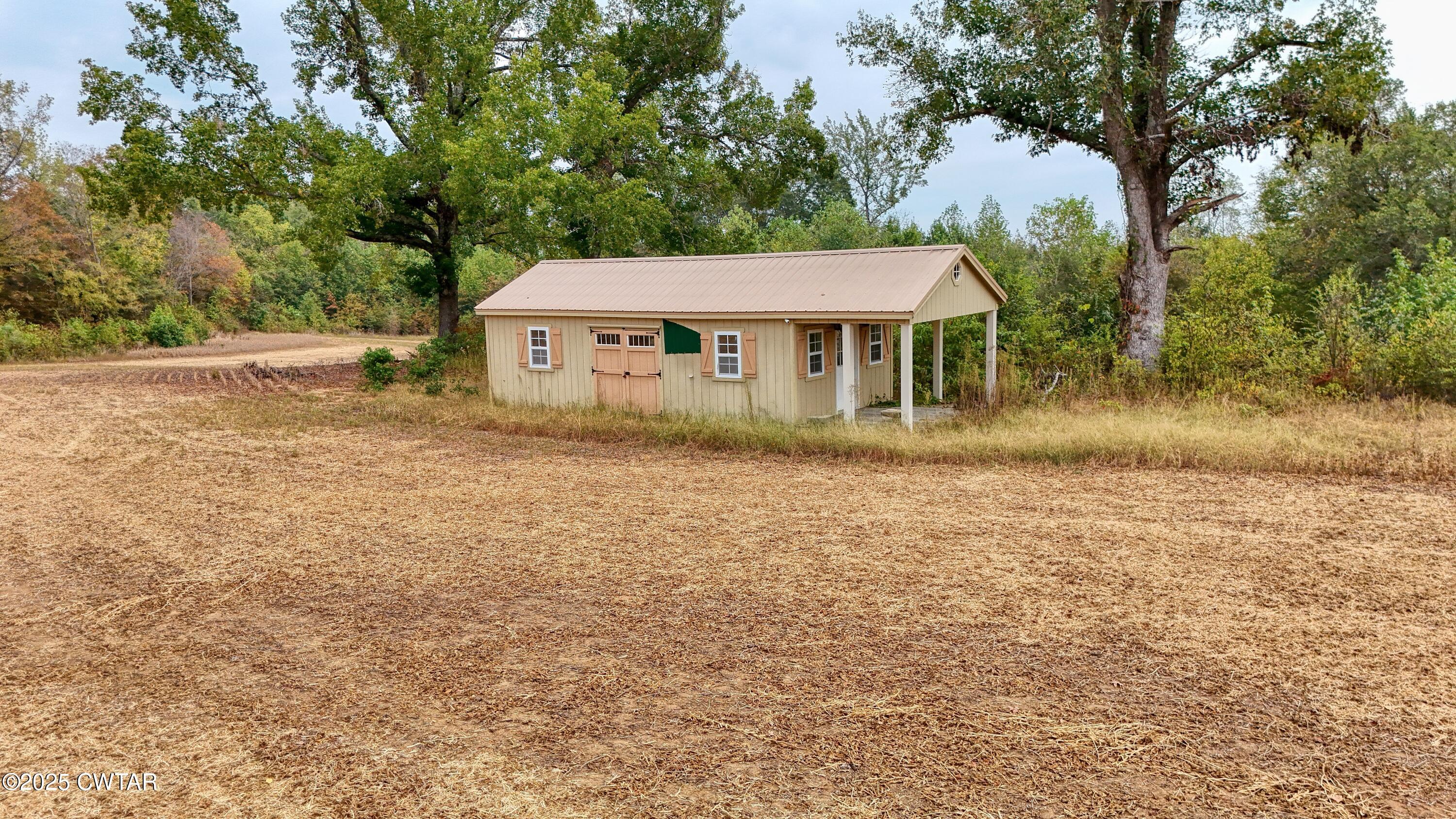 0 Tn-200 Huron, TN 38345 - Photo 10 of 13 a view of house with yard and entertaining space