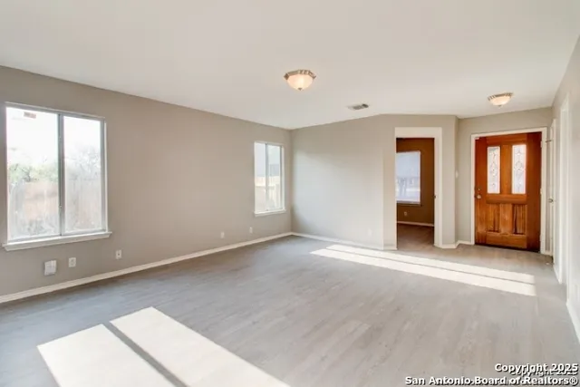 a view of an empty room with a window