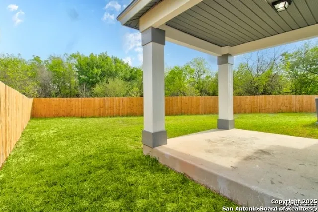 a view of backyard with green space