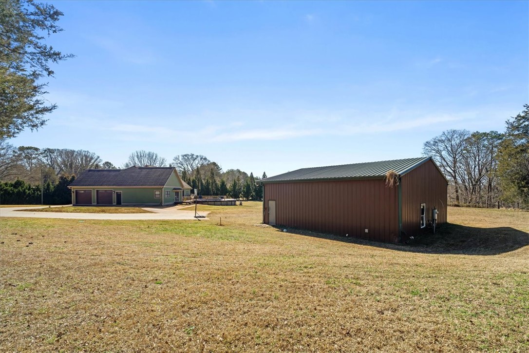 212 Winding Lane Seneca, SC 29672 - Photo 37 of 47 This expansive property offers a private oasis with a detached garage and a separate outbuilding.