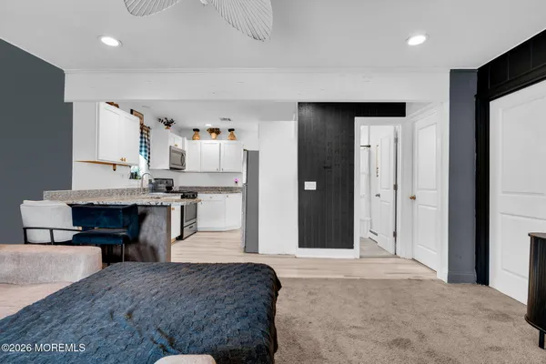 a bedroom with a bed and a dresser