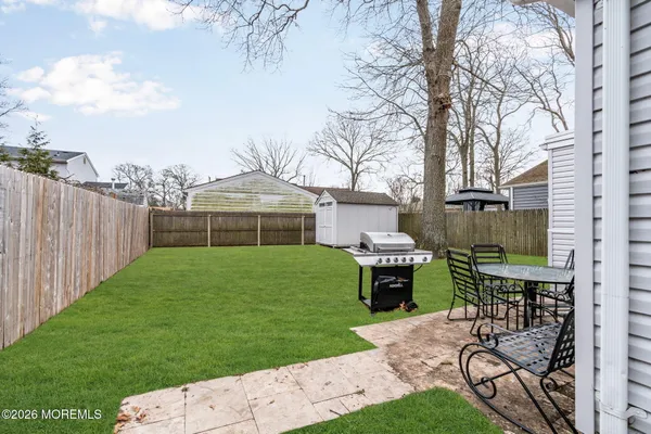 a front view of a house with garden and patio