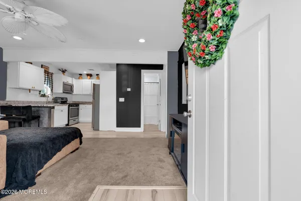 a living room with furniture and flowers