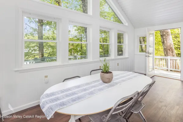 a room with a table and windows