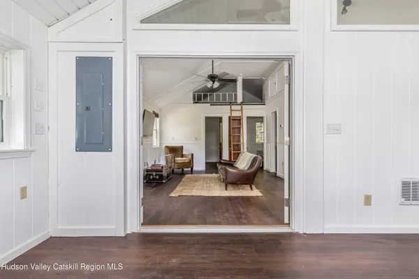 a view of a livingroom with furniture and windows