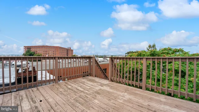 a view of a balcony with wooden floor