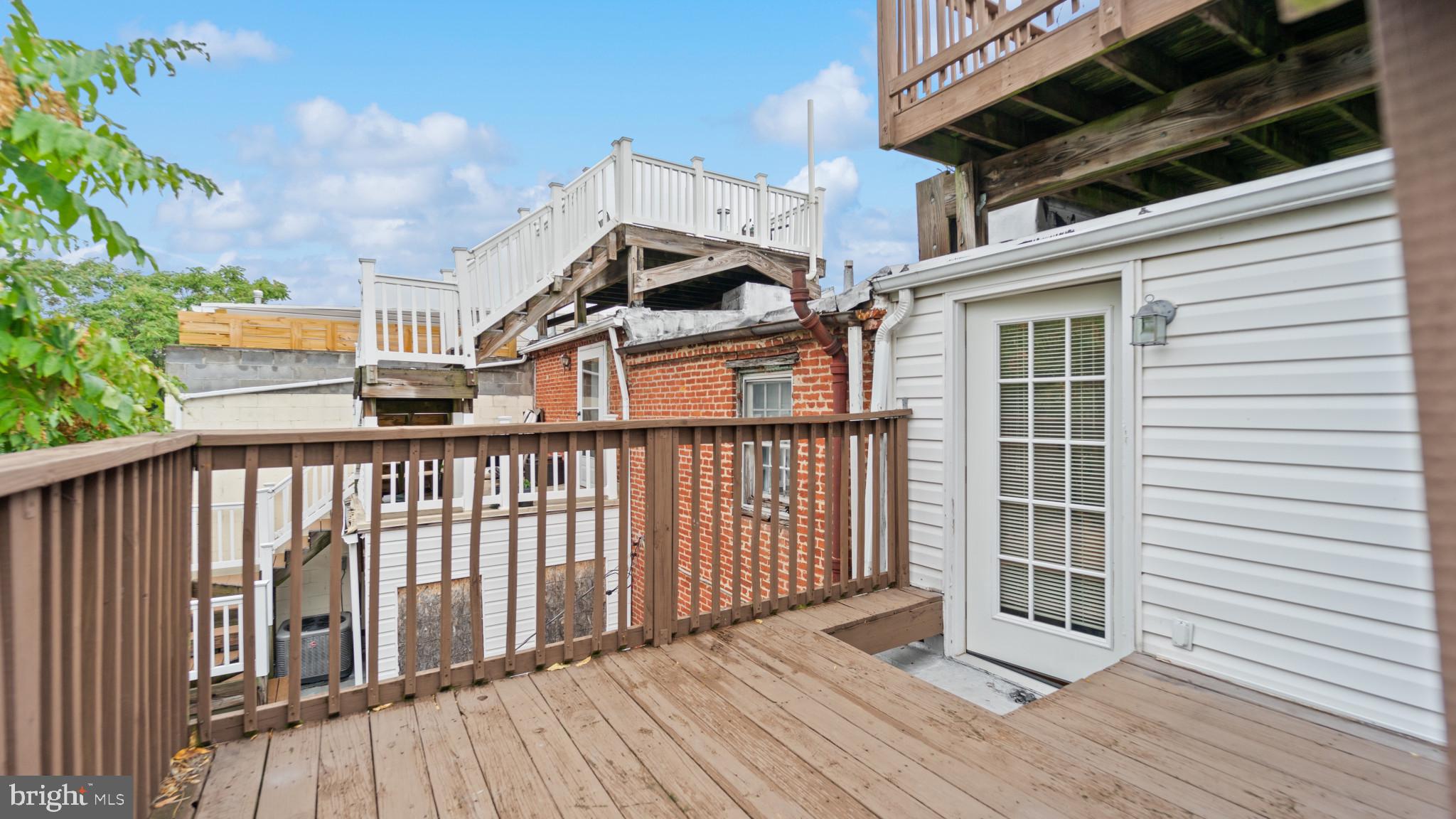 628 Scott Street Baltimore, MD 21230 - Photo 30 of 33 a view of a balcony with wooden floor
