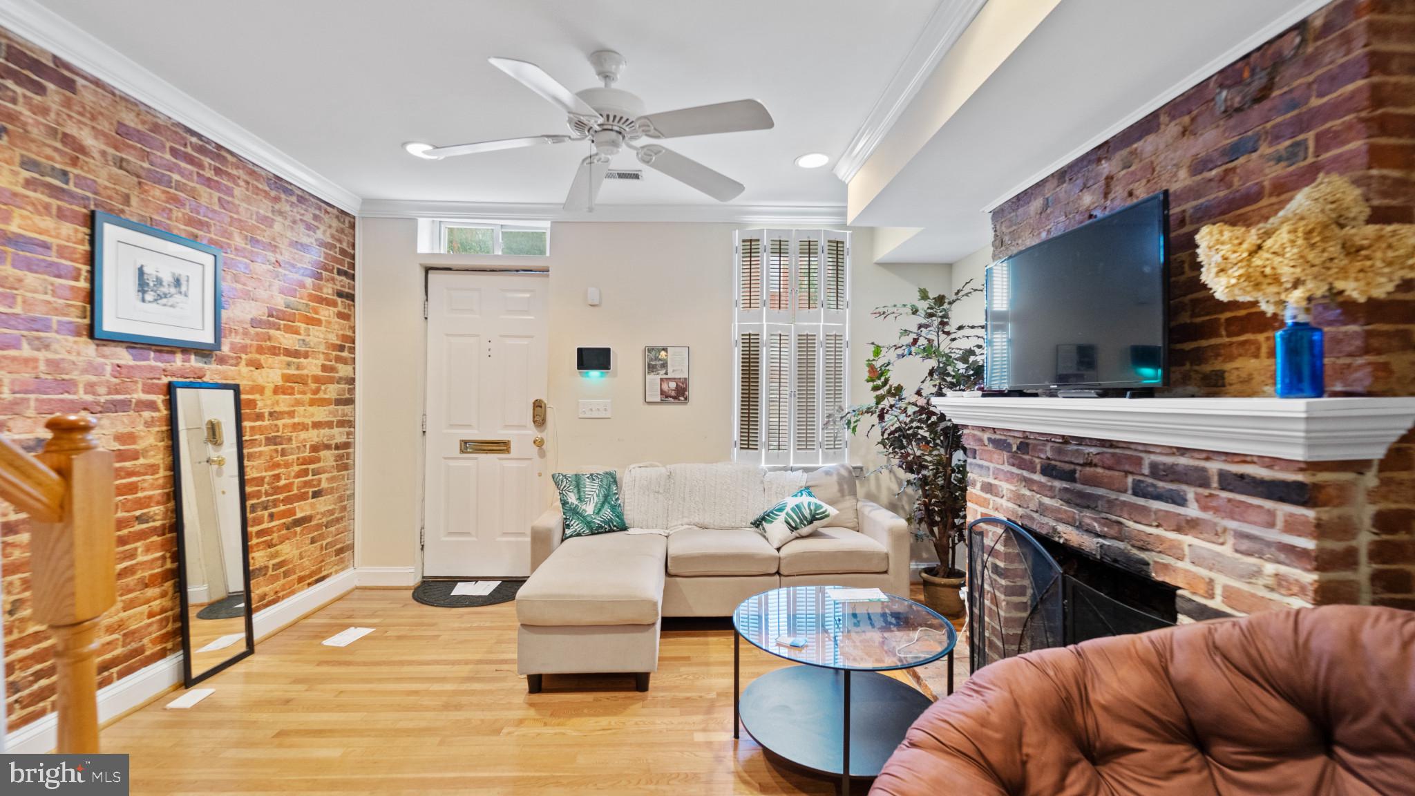 628 Scott Street Baltimore, MD 21230 - Photo 3 of 33 a living room with furniture and a fireplace