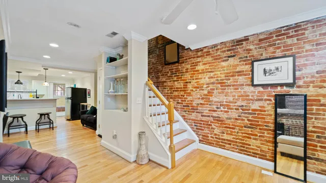 a view of livingroom with dining room and wooden floor