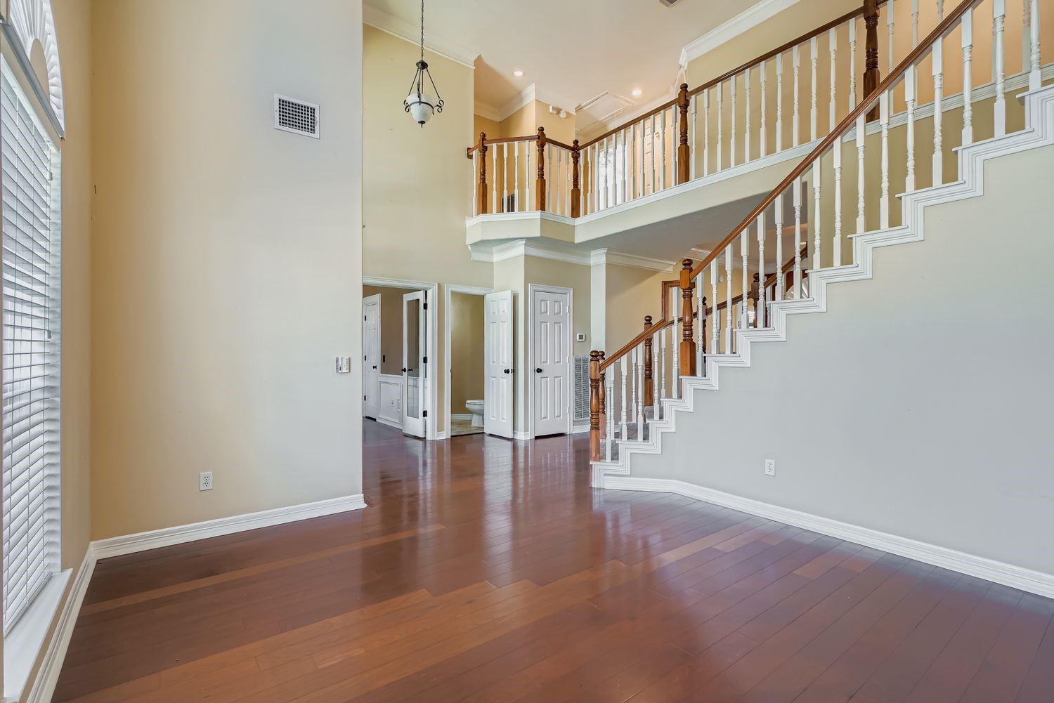 17415 Aspen Oak Court Spring, TX 77379 - Photo 35 of 39 a hallway with wooden floor and staircase