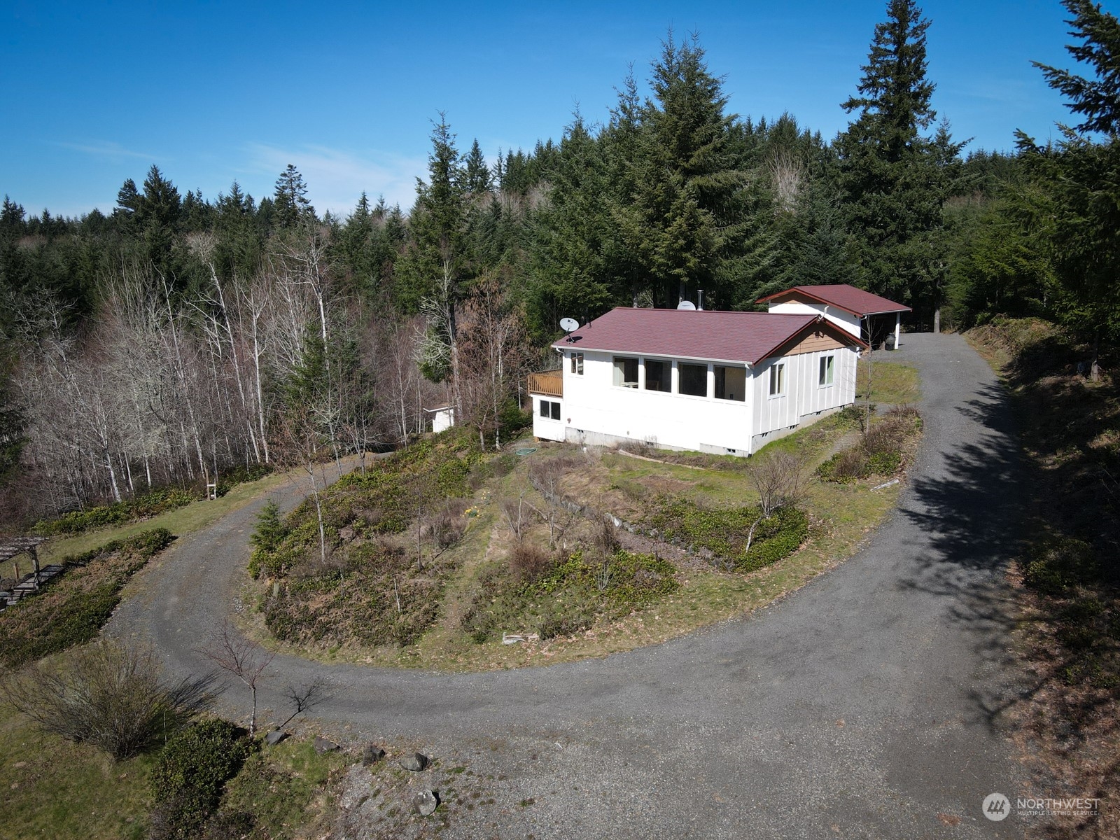 11243 Langworthy Road Southwest Rochester, WA 98579 - Photo 3 of 40 a view of a house with a yard