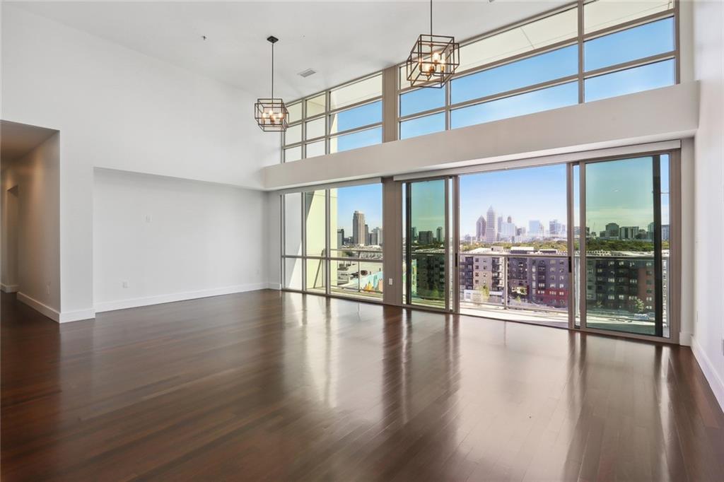 a view of an entryway with wooden floor