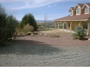 17300 Crossroads Ranch Road, Unit 63B Prescott, AZ 86305 - Photo 2 of 8 a view of a house with a yard