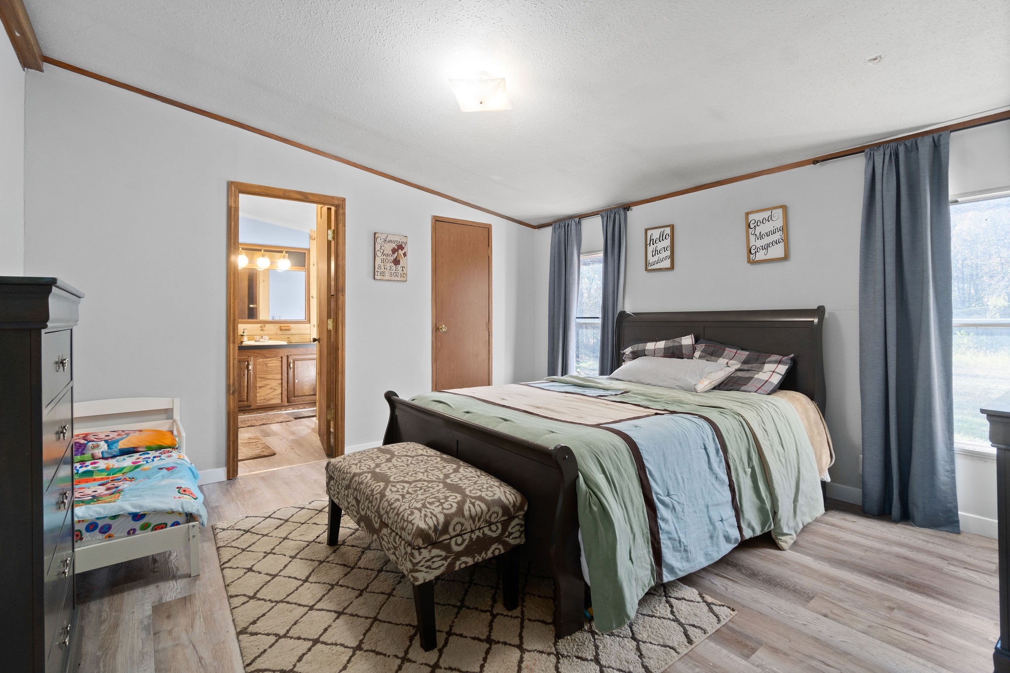 5820 Fred Perry Road Springfield, TN 37172 - Photo 29 of 33 a bedroom with a bed and wooden floor