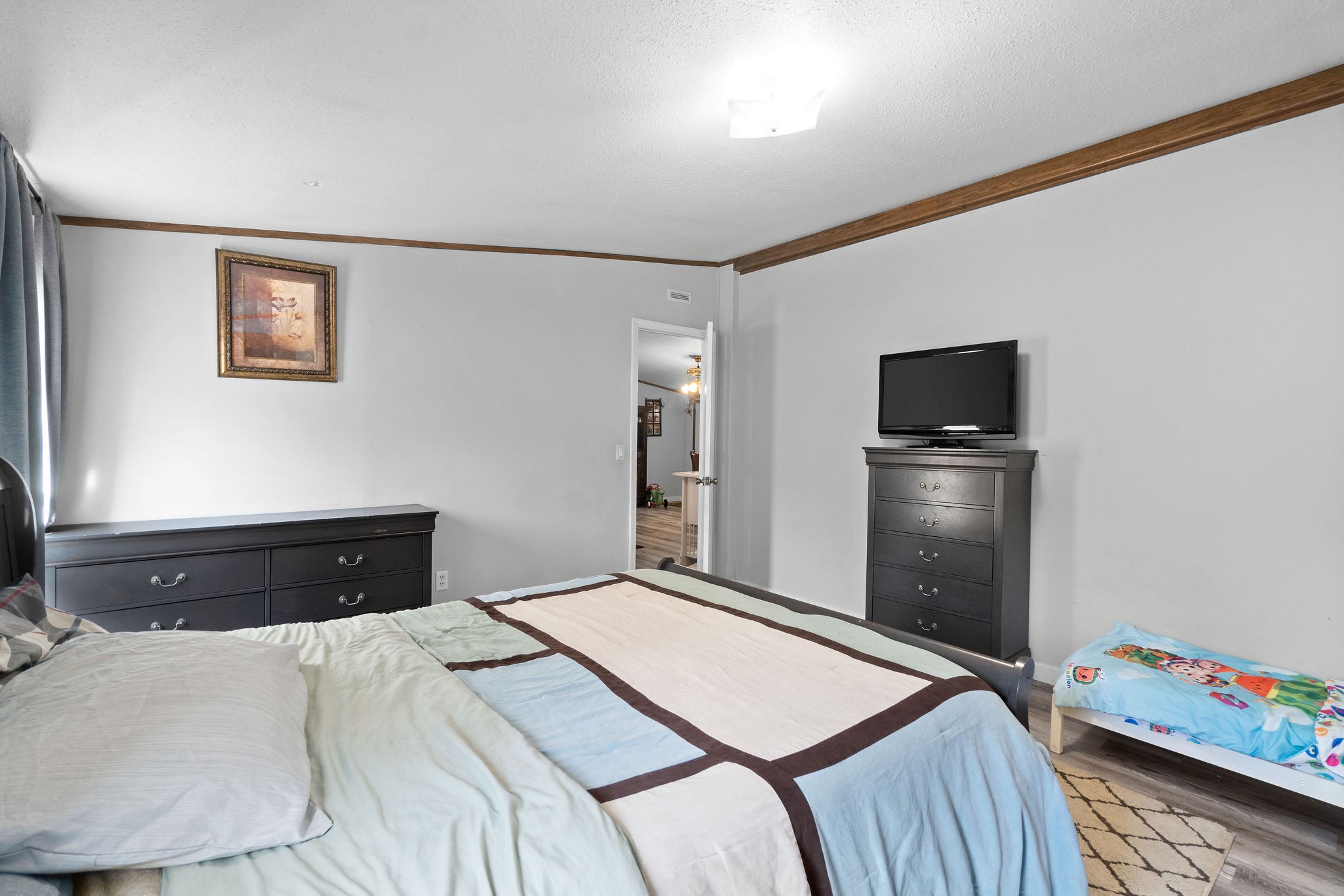 5820 Fred Perry Road Springfield, TN 37172 - Photo 30 of 33 a bedroom with a bed and a tv on the dresser