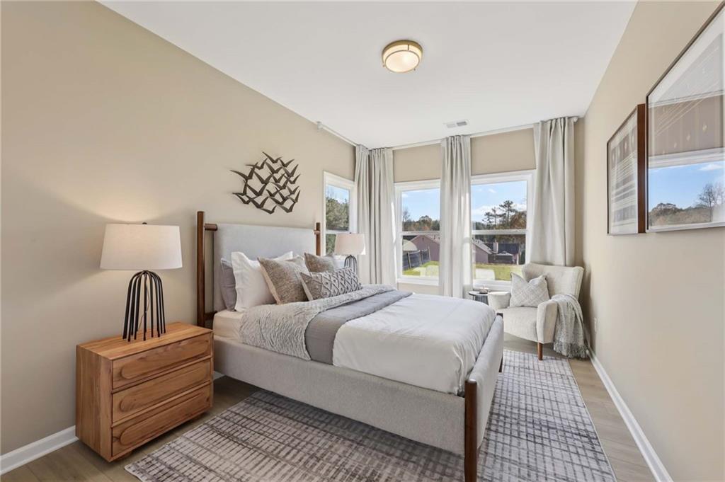 6205 Kismet Road Buford, GA 30518 - Photo 23 of 43 a bedroom with bed and window