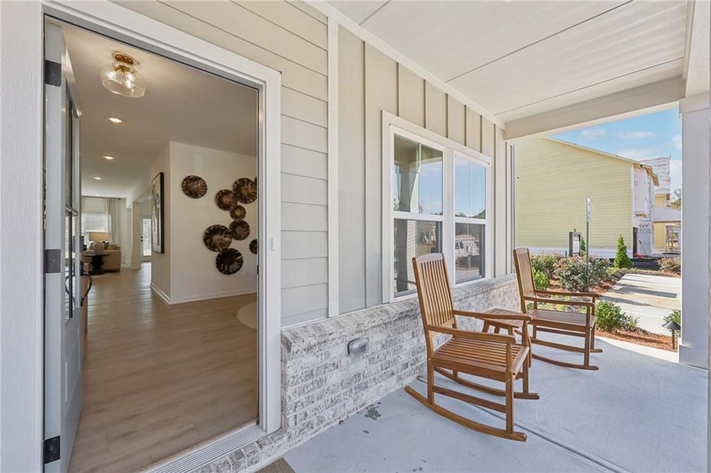 6205 Kismet Road Buford, GA 30518 - Photo 3 of 43 a view of livingroom with furniture and wooden floor