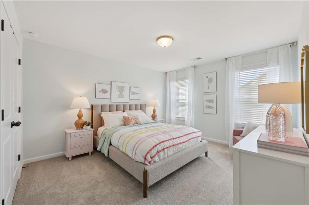 6205 Kismet Road Buford, GA 30518 - Photo 33 of 43 a bedroom with a bed and window