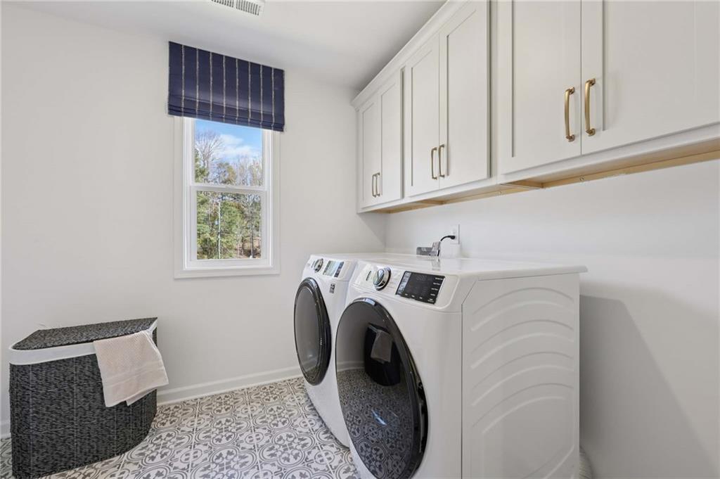 6205 Kismet Road Buford, GA 30518 - Photo 34 of 43 a utility room with dryer and washer