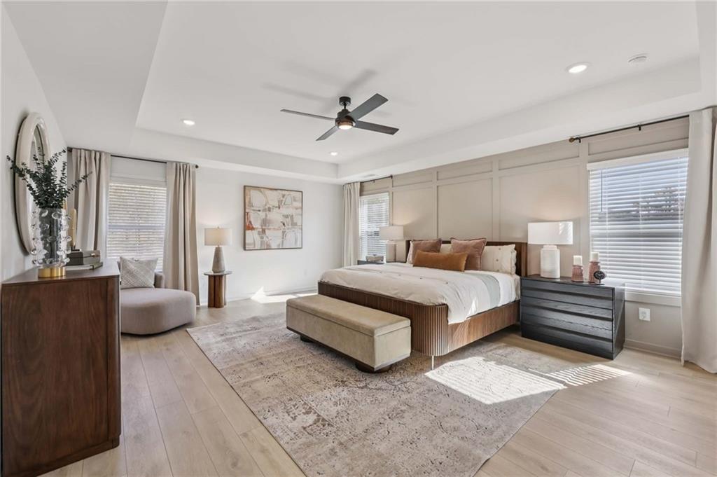 6205 Kismet Road Buford, GA 30518 - Photo 35 of 43 a bedroom with a large bed and furniture