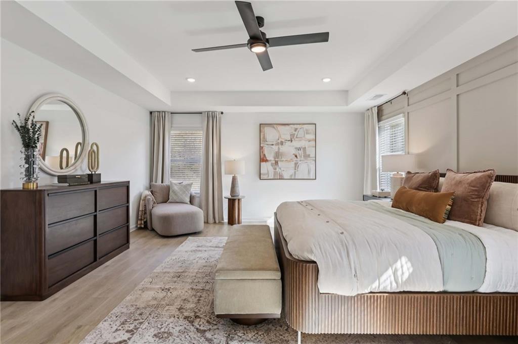 6205 Kismet Road Buford, GA 30518 - Photo 37 of 43 a bedroom with a large bed and a dresser