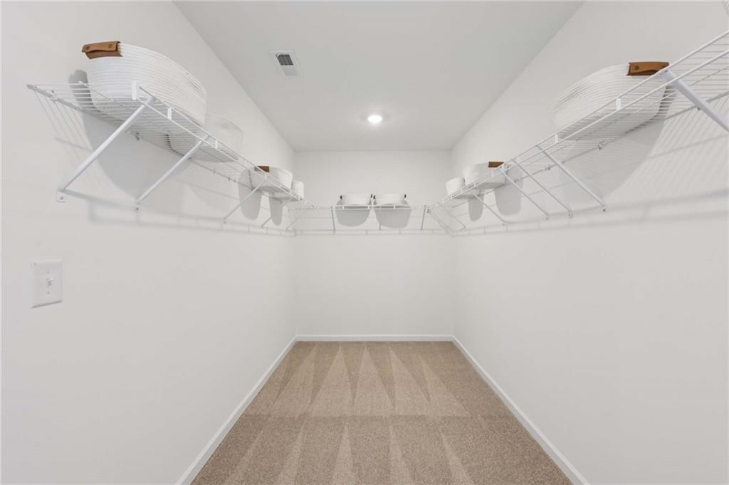 6205 Kismet Road Buford, GA 30518 - Photo 41 of 43 a view of a room with racks on the wall