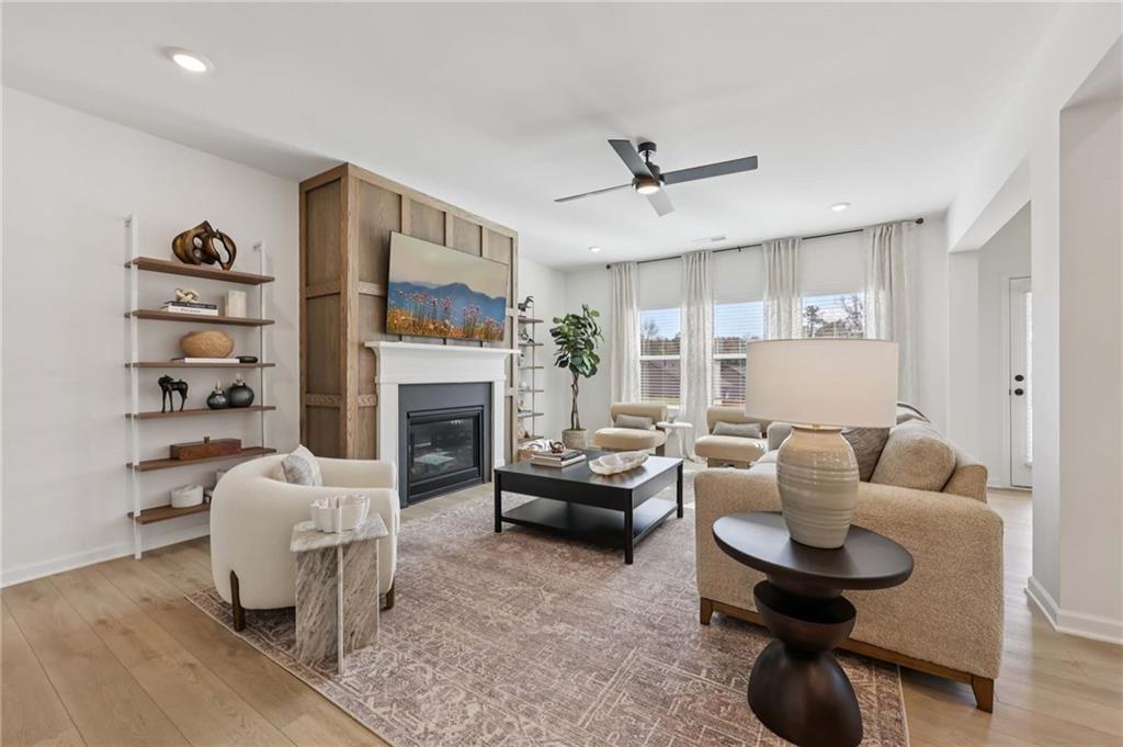 6205 Kismet Road Buford, GA 30518 - Photo 8 of 43 a living room with furniture and a fireplace