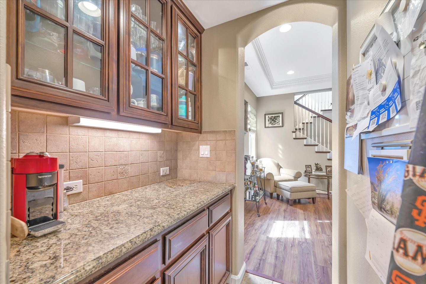 7522 Edinburgh Way Gilroy, CA 95020 - Photo 11 of 31 a kitchen with granite countertop lots of clutter and cabinets