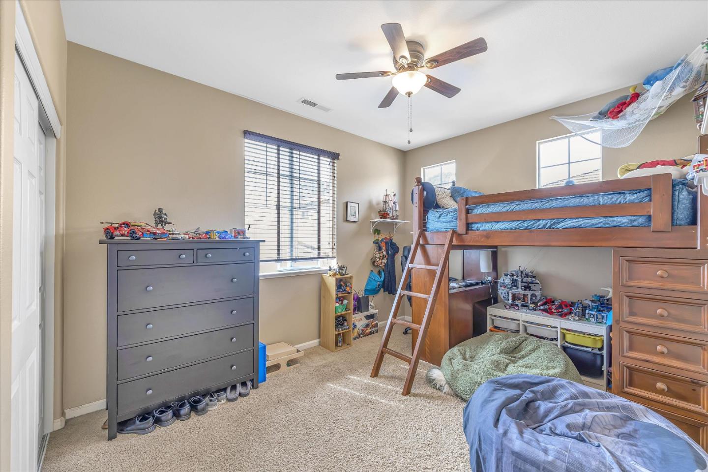 7522 Edinburgh Way Gilroy, CA 95020 - Photo 13 of 31 a bedroom with a bed and a chandelier