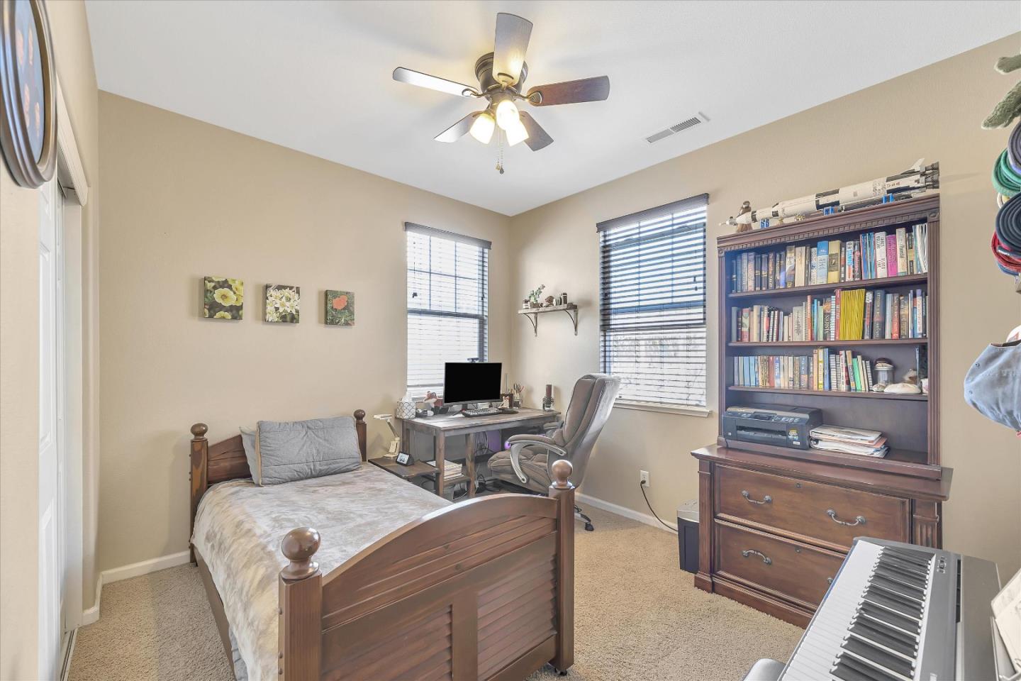 7522 Edinburgh Way Gilroy, CA 95020 - Photo 14 of 31 a workspace with furniture and a bookshelf