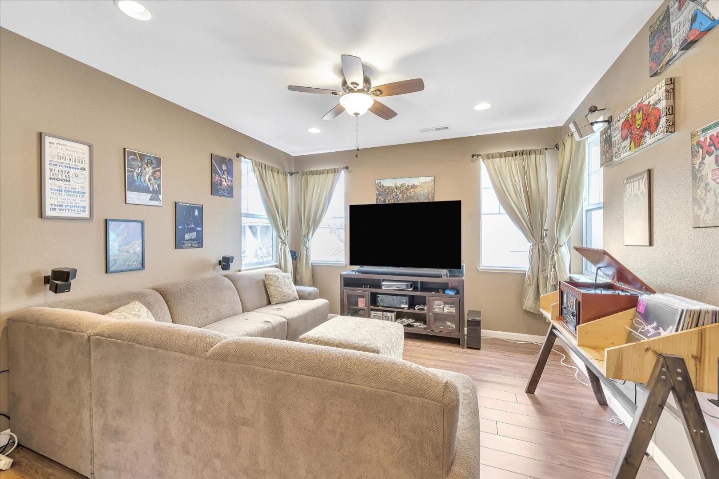 7522 Edinburgh Way Gilroy, CA 95020 - Photo 15 of 31 a living room with furniture and a flat screen tv