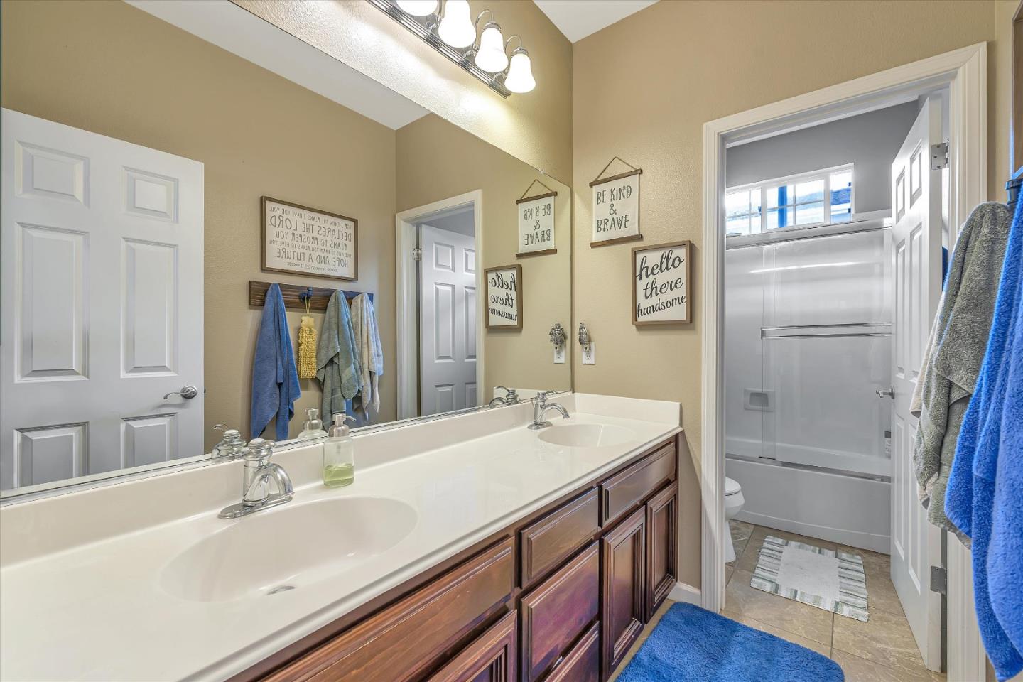 7522 Edinburgh Way Gilroy, CA 95020 - Photo 16 of 31 a bathroom with a sink double vanity and a mirror