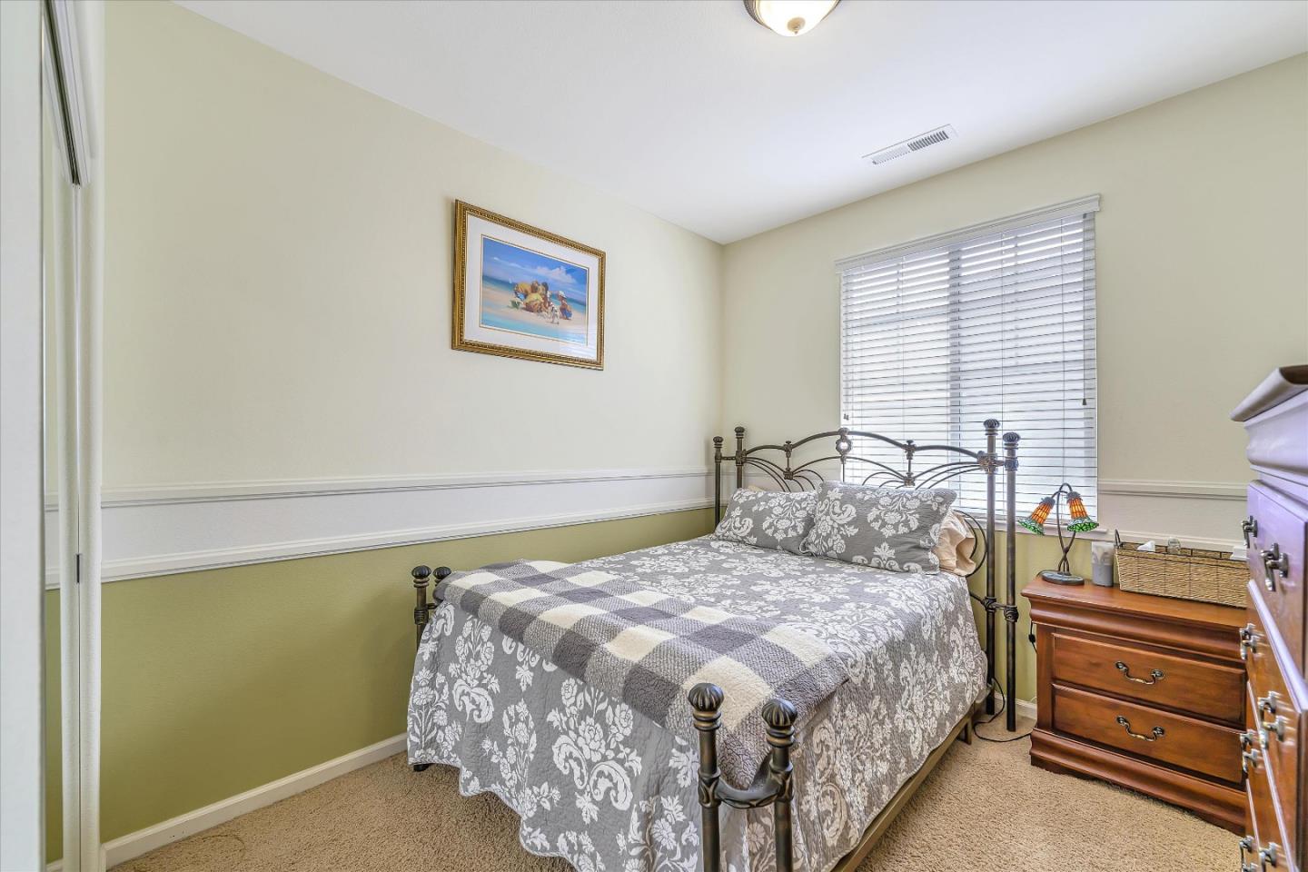 7522 Edinburgh Way Gilroy, CA 95020 - Photo 17 of 31 a bedroom with a bed and a window