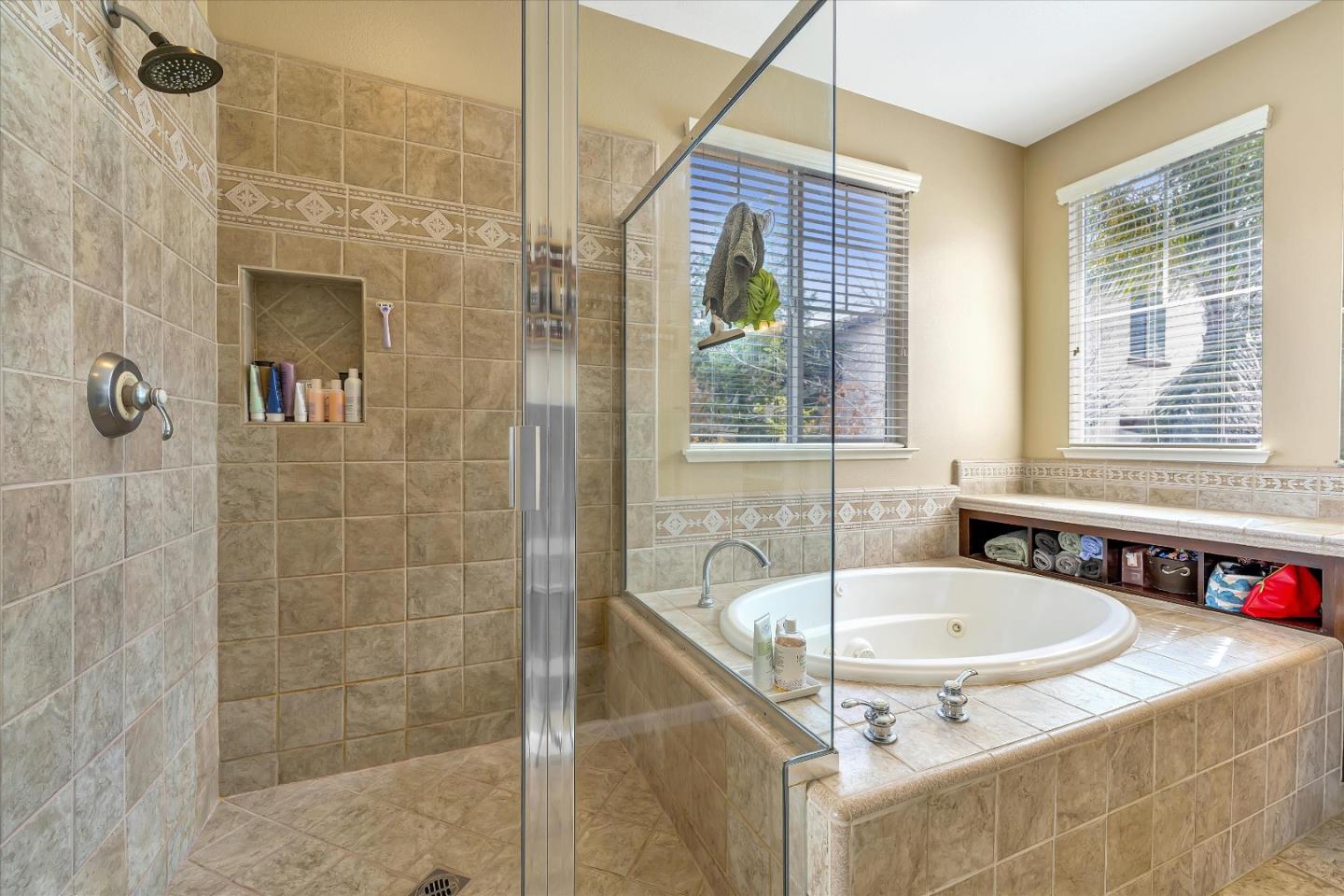 7522 Edinburgh Way Gilroy, CA 95020 - Photo 21 of 31 a bathroom with a tub and a shower