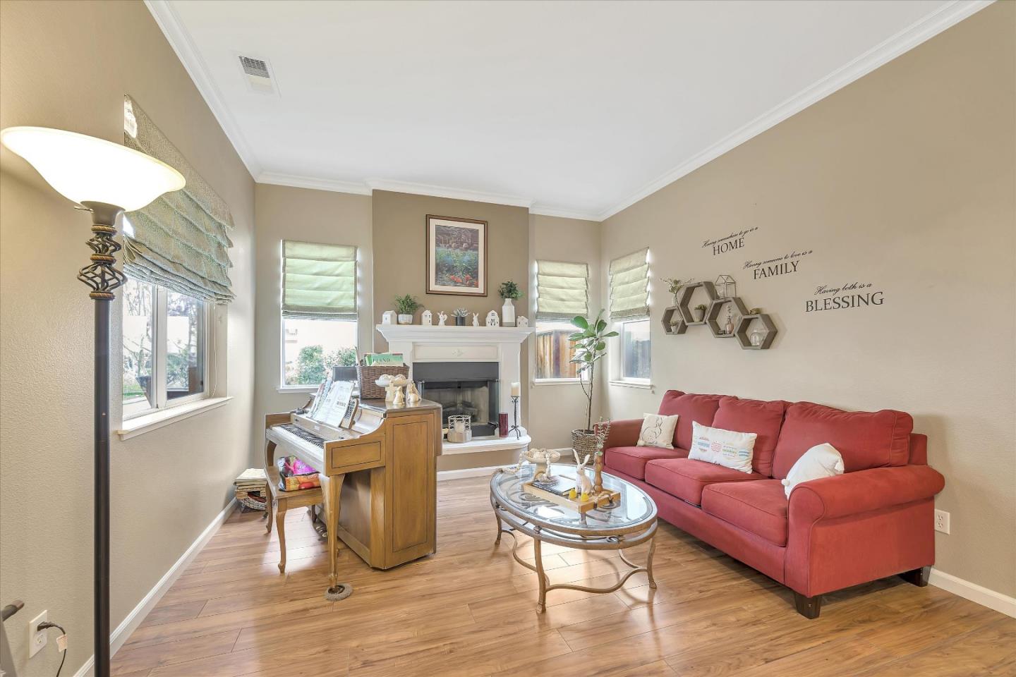 7522 Edinburgh Way Gilroy, CA 95020 - Photo 5 of 31 a living room with furniture and a fireplace