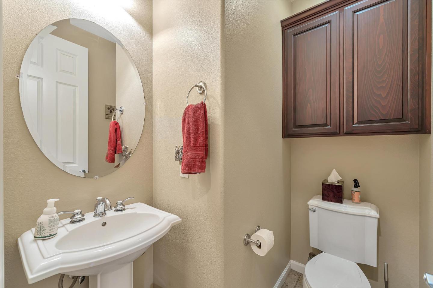 7522 Edinburgh Way Gilroy, CA 95020 - Photo 7 of 31 a bathroom with a sink mirror and toilet