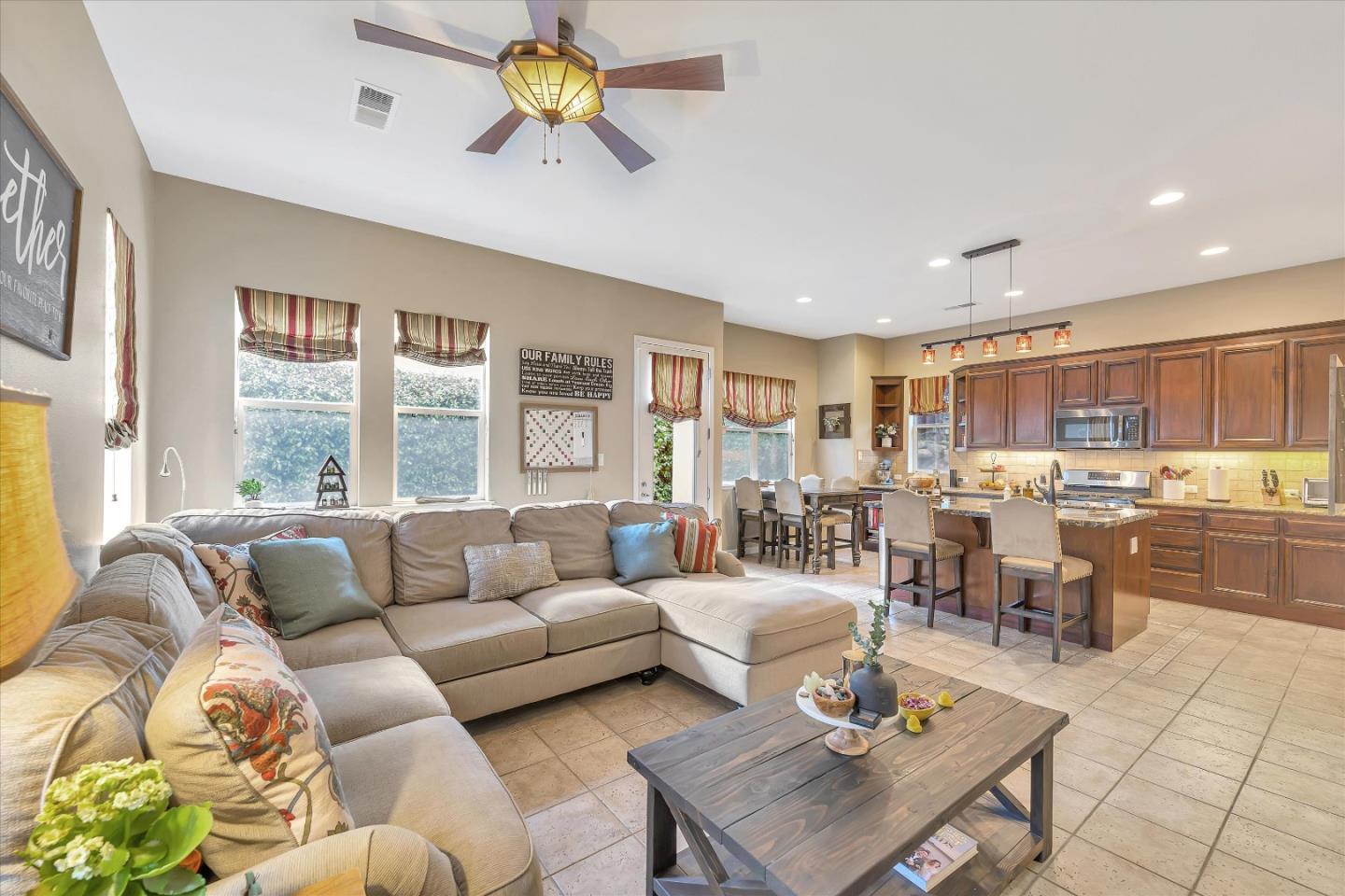 7522 Edinburgh Way Gilroy, CA 95020 - Photo 8 of 31 a living room with furniture and a large window