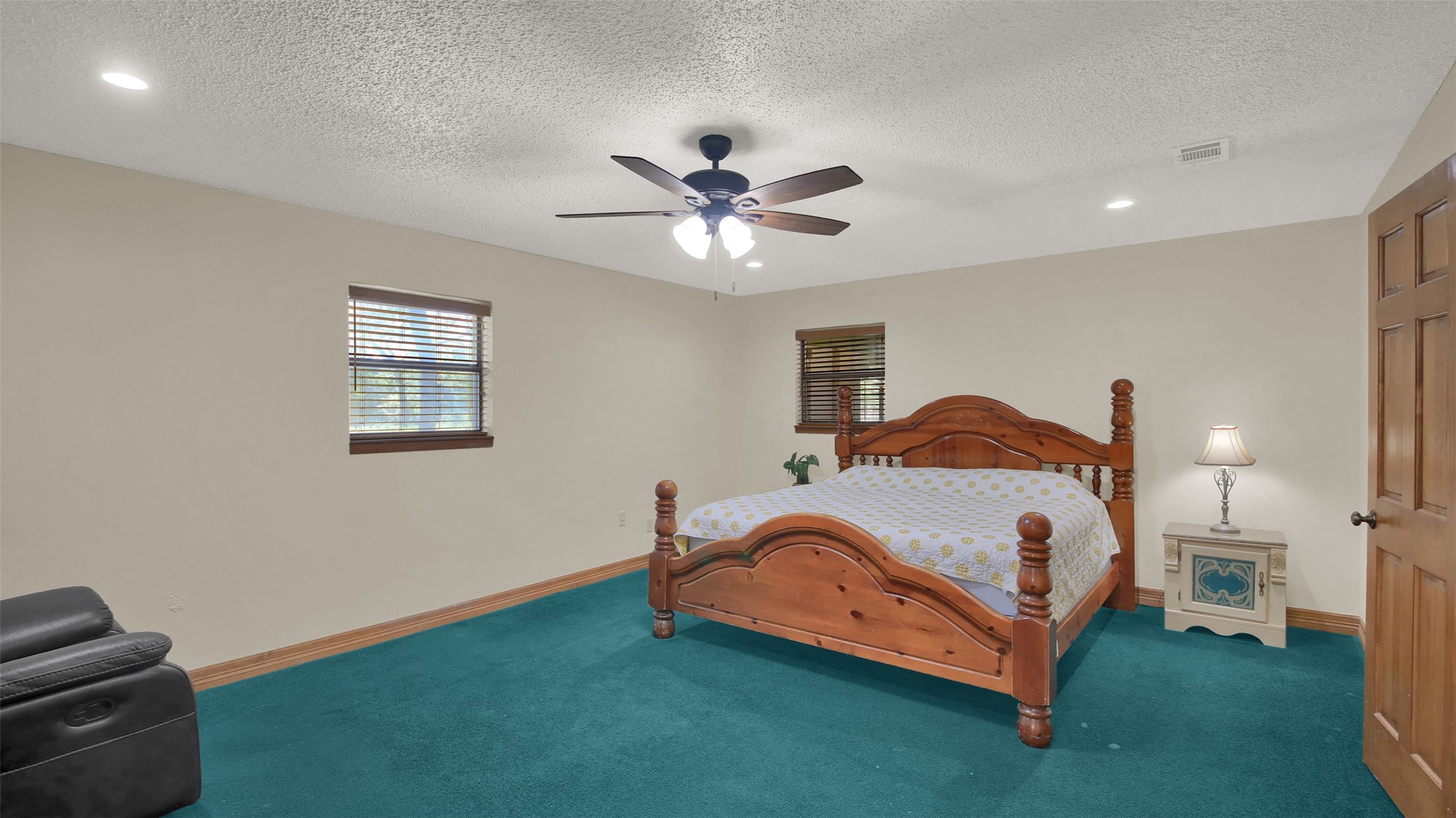191 Jordan Lane Elgin, TX 78621 - Photo 15 of 29 A spacious layout features textured ceilings and classic wood trim throughout the space.
