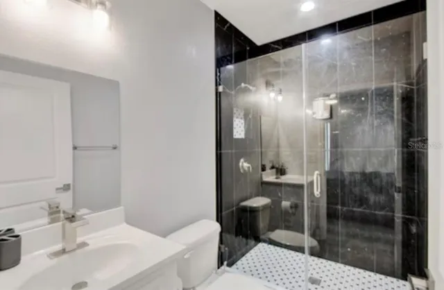 a bathroom with a sink and mirror