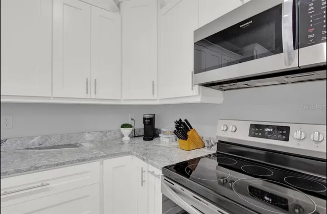 a view of a dining room with furniture and window