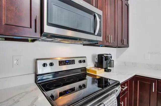 a kitchen with a stove and a microwave