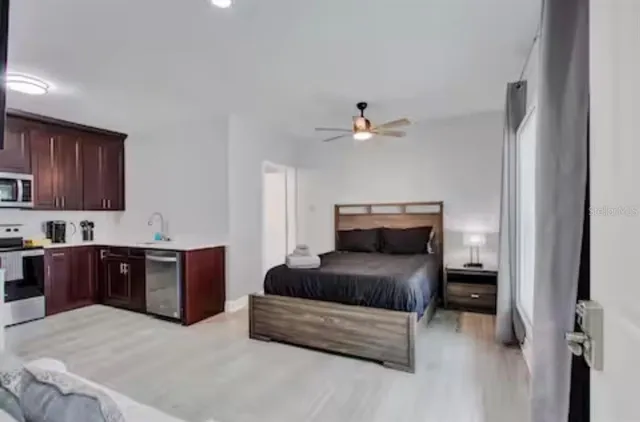 a bedroom with a bed and dresser